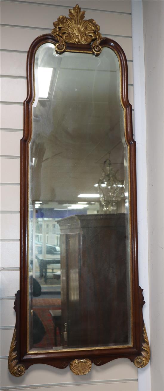 A pair of 18th century style mahogany framed wall mirrors, with giltwood pediments H.134cm